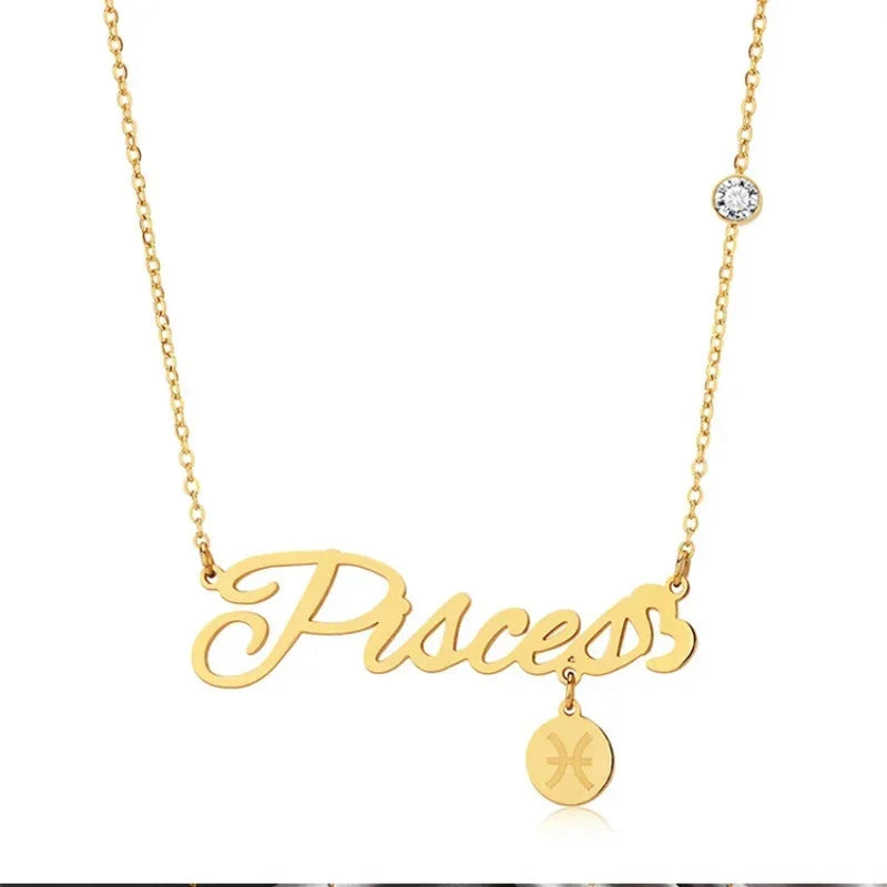 Gold necklace with the word “Pisces” in script font and a small round charm engraved with the Pisces zodiac symbol.