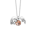A silver necklace with two bear-shaped pendants forming a hugging design, holding a small photo of a smiling woman in the center.