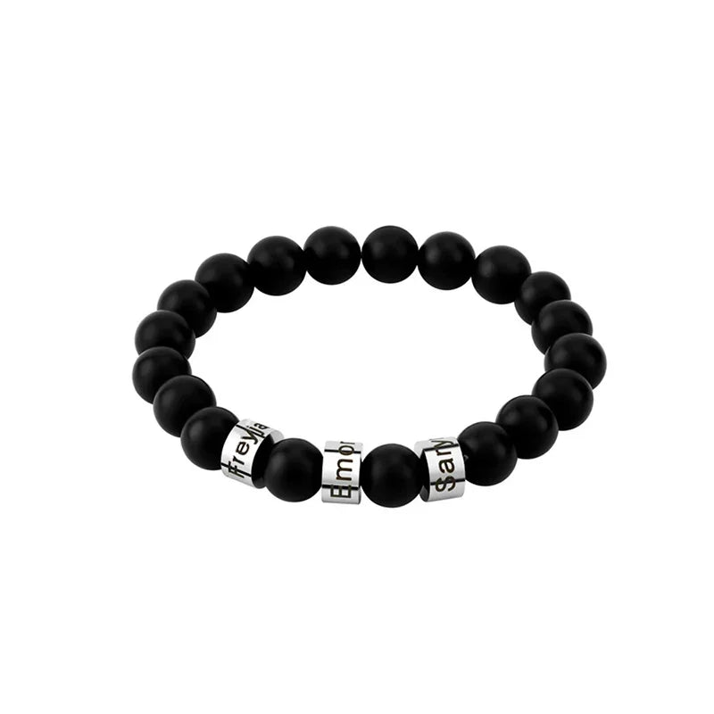 A sleek black obsidian beaded bracelet featuring customizable silver name rings, designed for men with a bold and elegant style.
