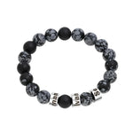 A men’s snowflake stone beaded bracelet with customizable black engraved name rings, designed for a bold and stylish look.