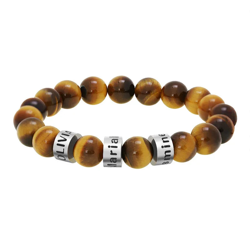 A men’s tiger eye beaded bracelet with engraved silver name rings, showcasing warm brown tones and a polished, elegant design.