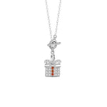 A silver necklace featuring a pendant shaped like a gift box, adorned with sparkling zircon stones and a bow detail, with three orange zircon accents in the center.