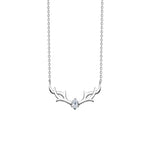 A delicate silver necklace featuring an elegant antler design with a single teardrop-shaped gemstone at the center, symbolizing winter charm and festive elegance.