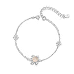 Elegant silver bracelet featuring three snowflake charms.The center snowflake is adorned with a sparkling zircon stone.