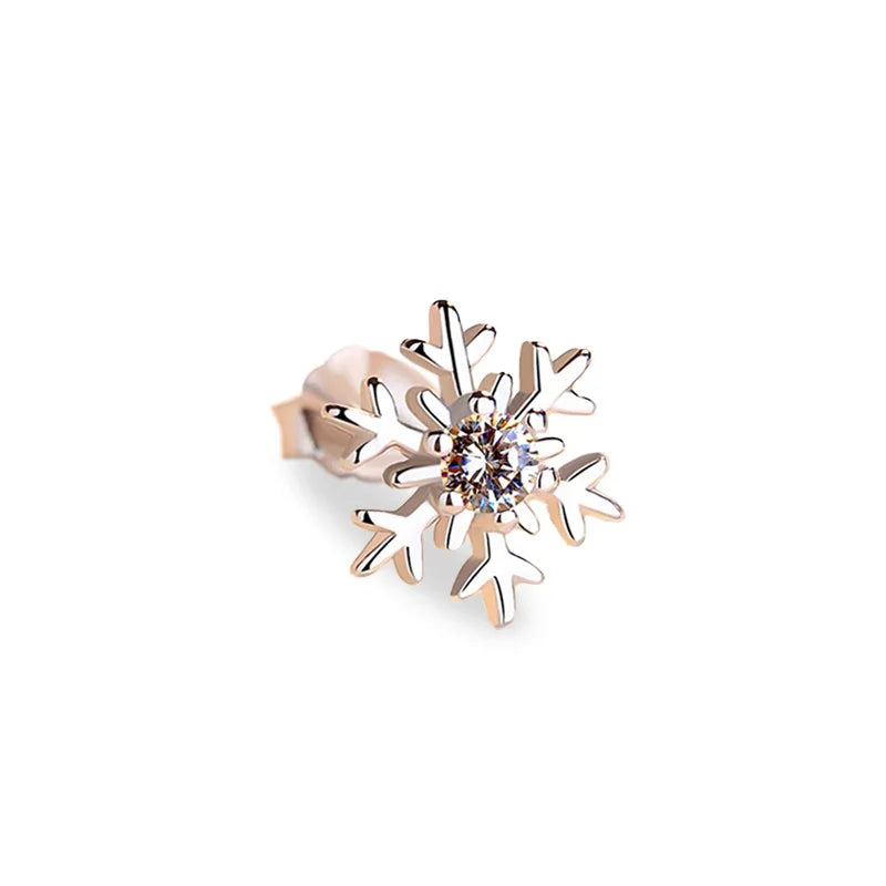 Silver snowflake stud earring with a sparkling zircon stone in the center on a white background.