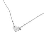 A minimalist silver necklace featuring a small heart-shaped pendant engraved with delicate text, displayed against a white background for a clean and elegant presentation.