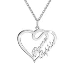 Silver heart-shaped necklace with two engraved names and an infinity-inspired design hanging from a delicate chain.