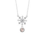 A delicate silver necklace featuring a snowflake-shaped pendant with sparkling crystal details and a round shimmering glaze stone drop, displayed on a white background.