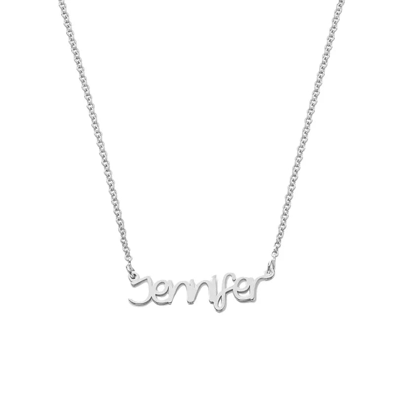 A minimalist silver name necklace featuring the word ‘Jennifer’ in a cursive script, displayed on a white background.