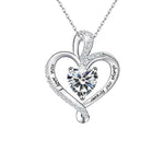 A heart-shaped sterling silver necklace featuring a sparkling birthstone at the center, engraved with “Endless Devotion,” symbolizing eternal love.