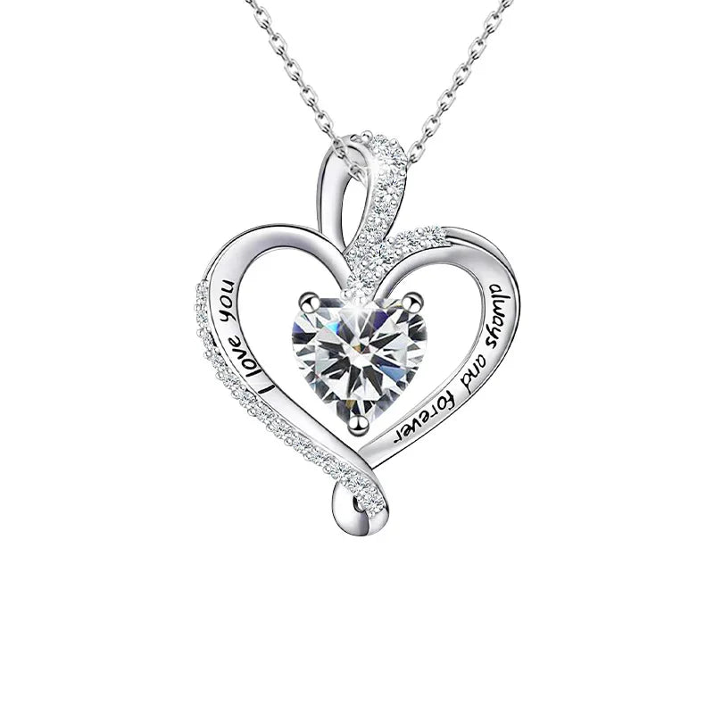 A heart-shaped sterling silver necklace featuring a sparkling birthstone at the center, engraved with “Endless Devotion,” symbolizing eternal love.