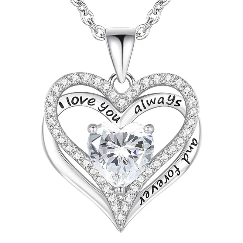 Silver double-heart pendant featuring a central heart-shaped gemstone and engraved text that reads “I love you always and forever,” displayed on a white background.