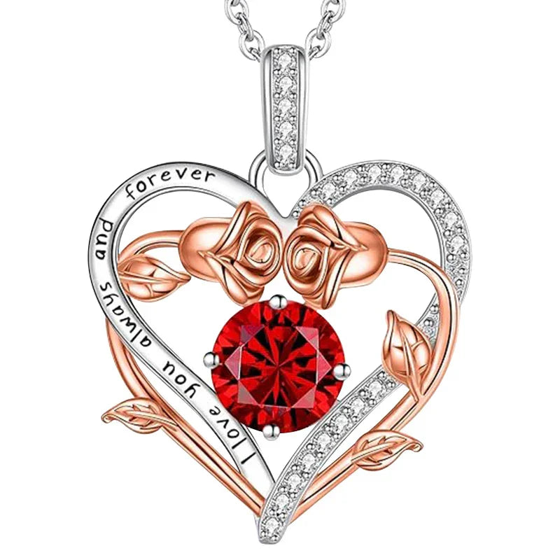 Two-tone heart-shaped pendant featuring rose gold roses, a central red gemstone, and engraved text reading “I love you for always and forever,” displayed on a white background.