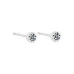 Pair of silver stud earrings with clear gemstones on a white background