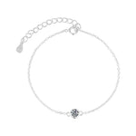Silver bracelet with a small round clasp on a white background