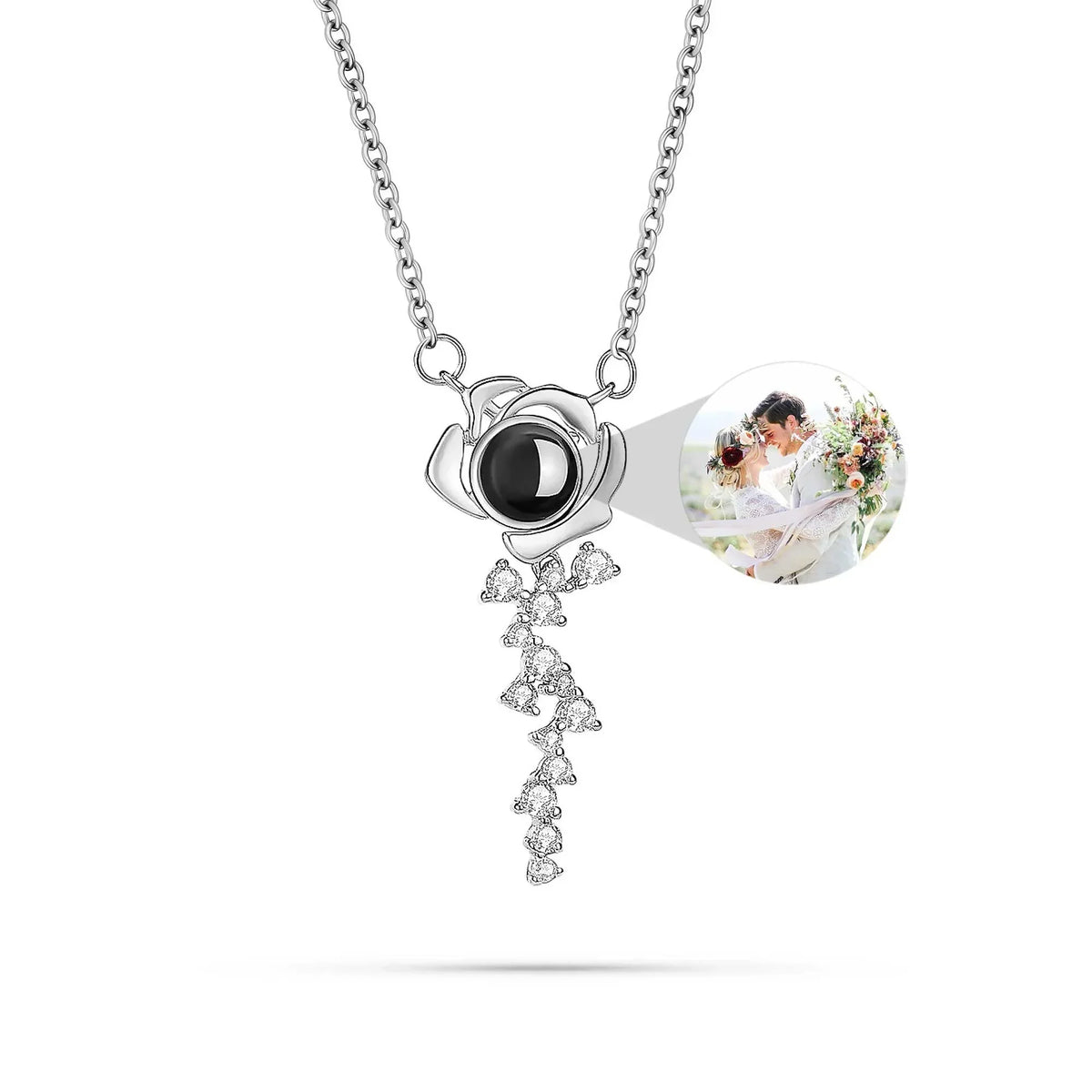 Silver necklace with a heart-shaped pendant featuring a photo of a couple on a white background