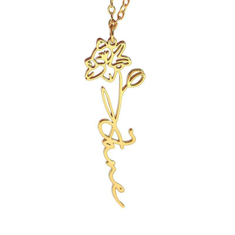Gold necklace with a floral design on a white background