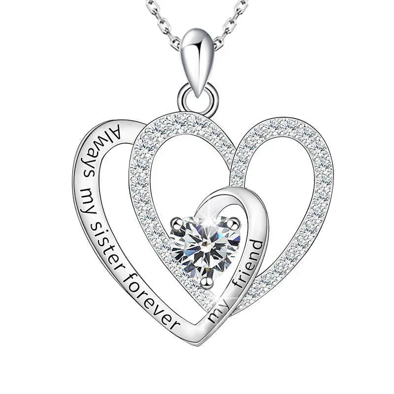 Silver double-heart pendant featuring a central round gemstone and engraved text that reads “Always my sister forever my friend,” displayed on a white background.