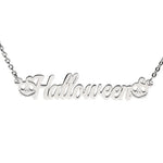 A silver necklace featuring the word "Halloween" in elegant cursive lettering, decorated with two carved pumpkin faces—one on each end of the word—adding a festive and playful Halloween theme. 