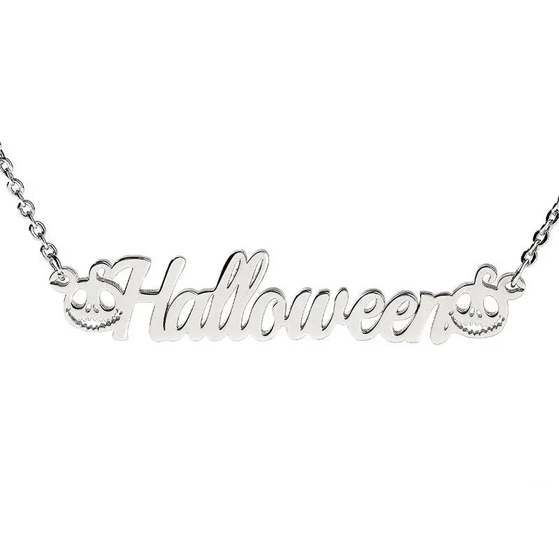 A silver necklace featuring the word "Halloween" in elegant cursive lettering, decorated with two carved pumpkin faces—one on each end of the word—adding a festive and playful Halloween theme. 
