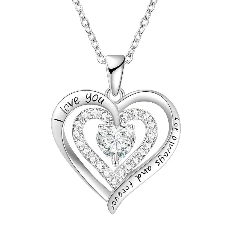 Silver double-heart pendant featuring a central heart-shaped gemstone and engraved text reading “I love you for always and forever,” displayed on a white background.