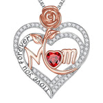 Heart-shaped pendant with rose, red gem, and 'Mom' text on a white background