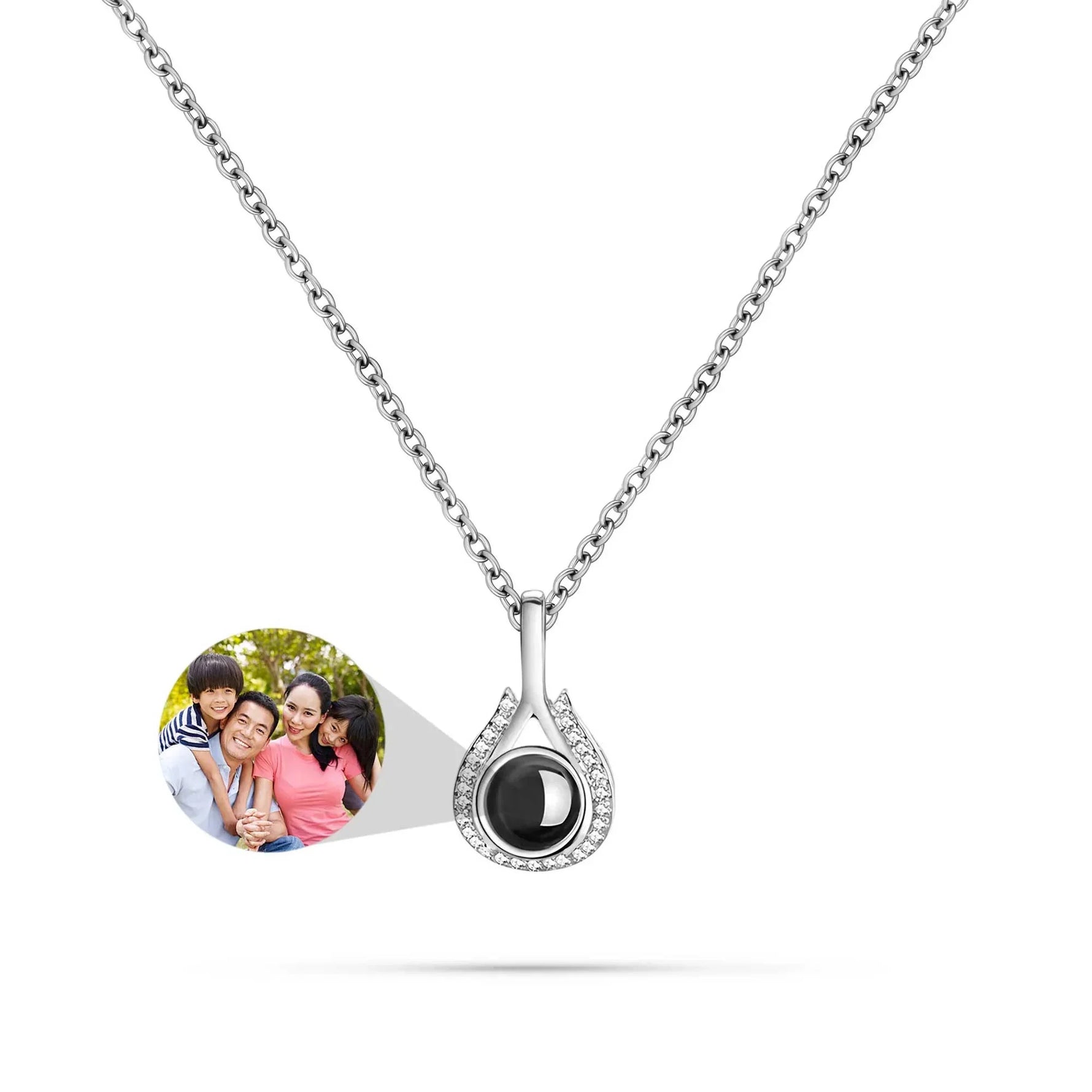 Silver necklace with a black pendant featuring a photo of two children on a white background