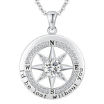 Silver compass necklace with diamond in the center on a white background