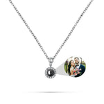 Necklace with a round pendant featuring a photo of a couple on a white background