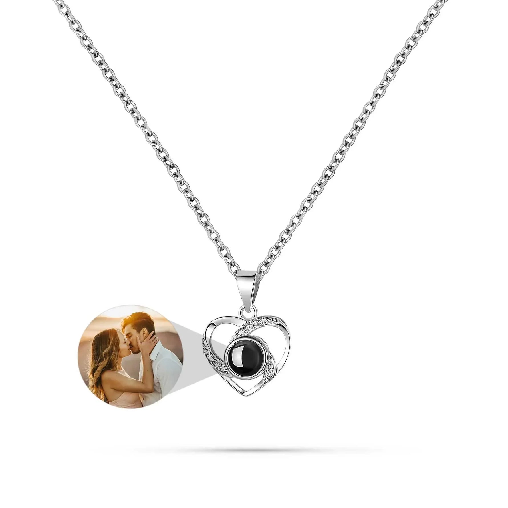 Heart-shaped pendant with a photo of a couple on a white background