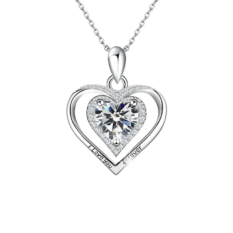 Heart-shaped silver pendant with 'I love you' engraving on a white background