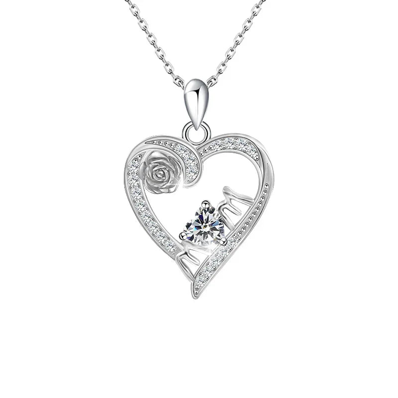 A silver heart-shaped necklace with a rose detail and heartbeat design, featuring a radiant birthstone that symbolizes love’s eternal rhythm.