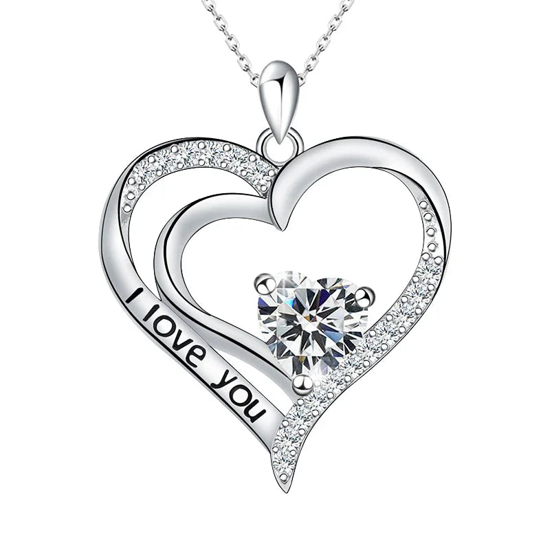 A silver open-heart necklace engraved with “I love you,” featuring a heart-shaped birthstone that symbolizes a heartfelt promise of eternal love.