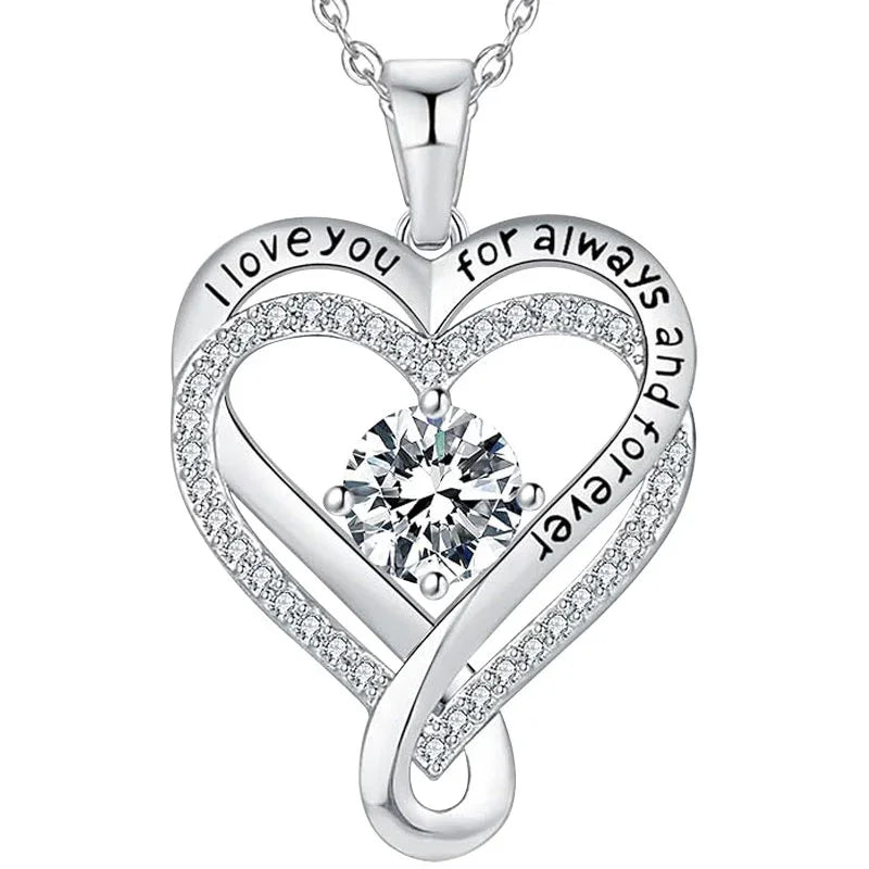 Silver double-heart pendant featuring a central round gemstone and engraved text that reads “I love you for always and forever,” displayed on a white background.