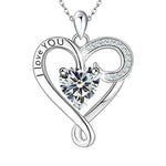 A silver infinity heart necklace with a sparkling heart-shaped birthstone at the center, engraved with “I love you,” symbolizing eternal love.
