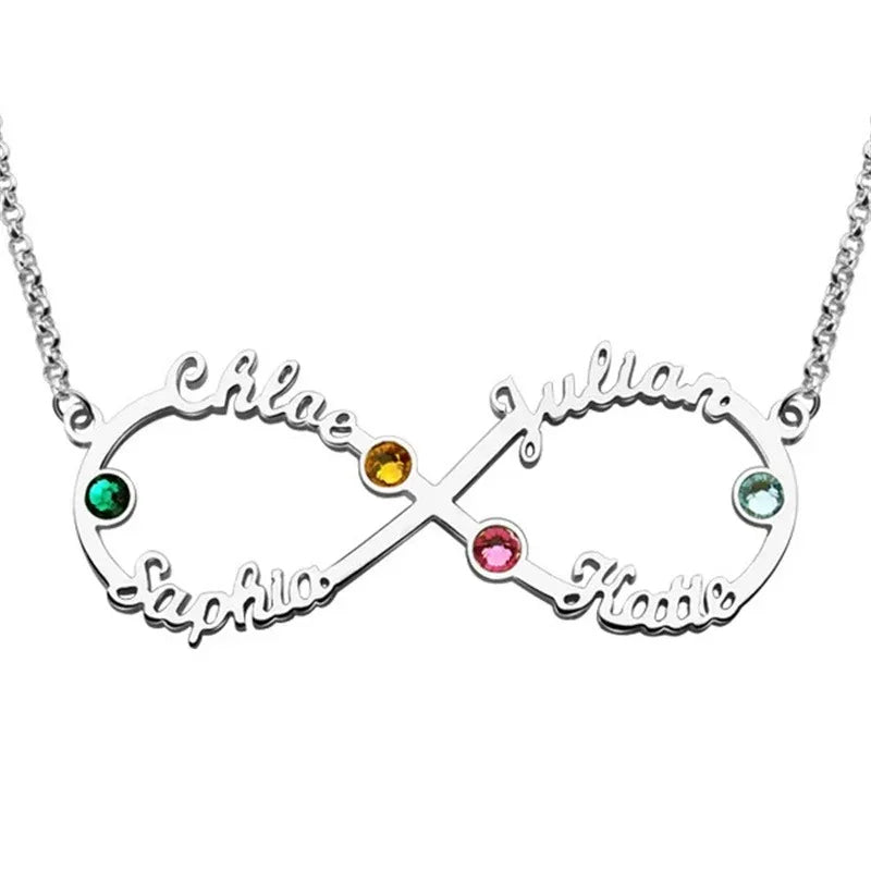 A silver infinity-shaped necklace featuring four engraved names — Chloe, Sophia, Julian, and Katie — each paired with colorful birthstones in green, yellow, pink, and blue, symbolizing eternal love and family connection.