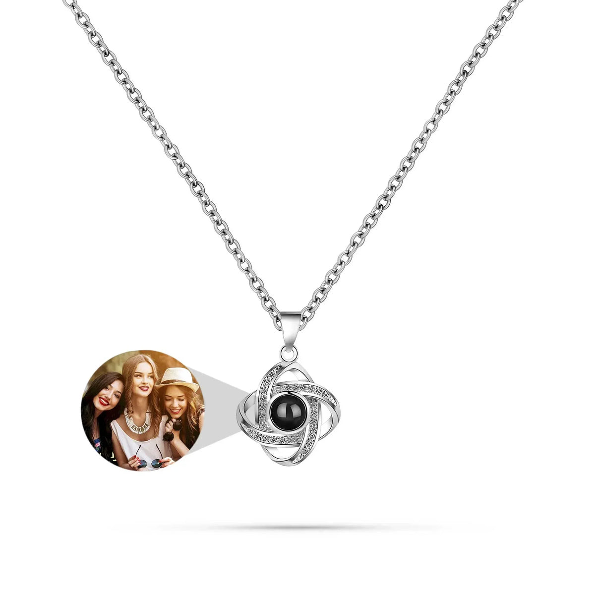 Necklace with a round pendant featuring a photo of three women on a white background