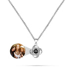 Necklace with a round pendant featuring a photo of three women on a white background