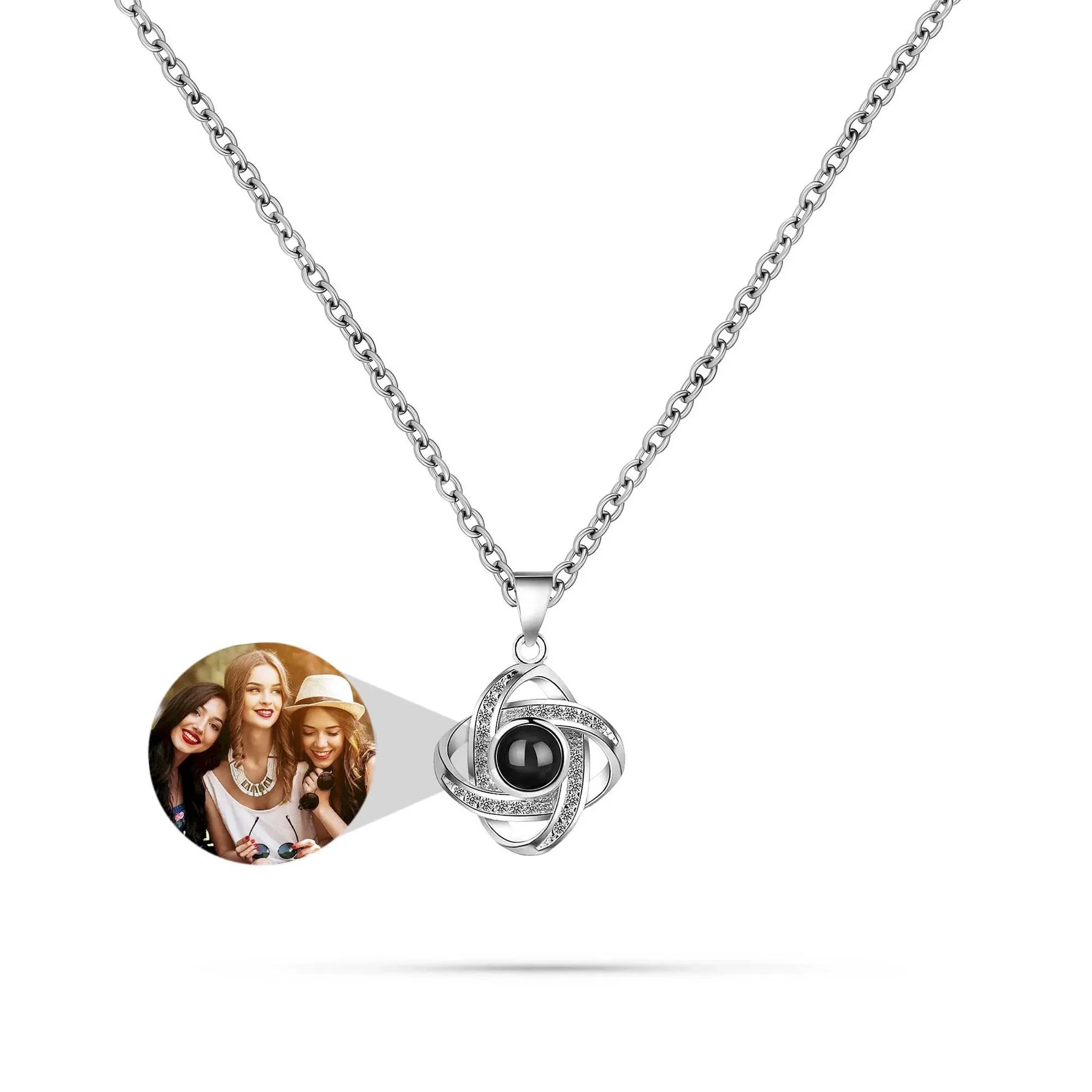 Necklace with a round pendant featuring a photo of three women on a white background