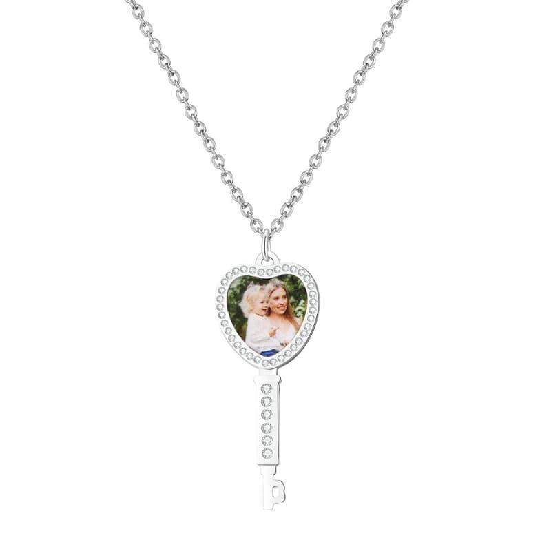 Heart-shaped pendant with a photo on a white background