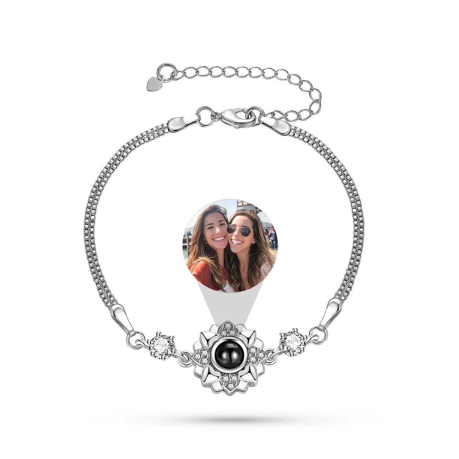 Silver bracelet with a heart-shaped photo charm featuring two people, on a white background.