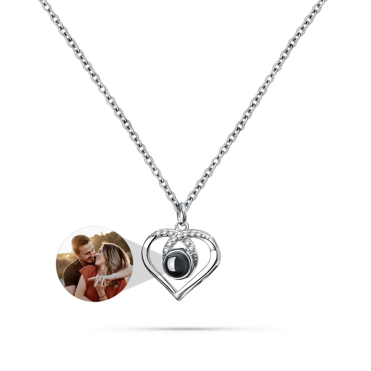 Heart-shaped pendant with a photo insert on a white background