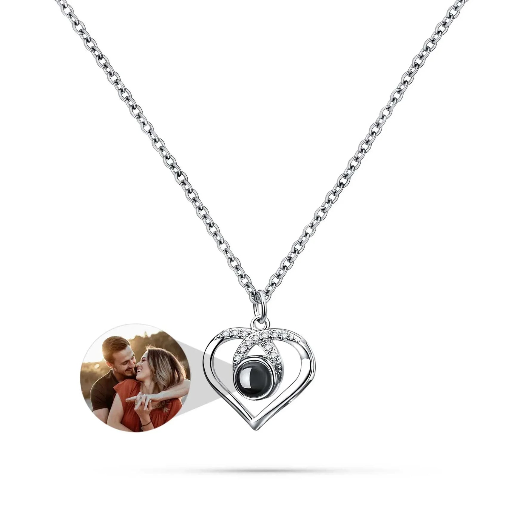 Heart-shaped pendant with a photo insert on a white background