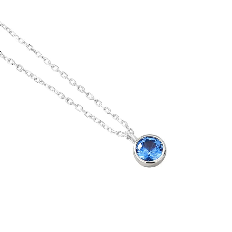 Necklace with a blue gemstone pendant on a white background