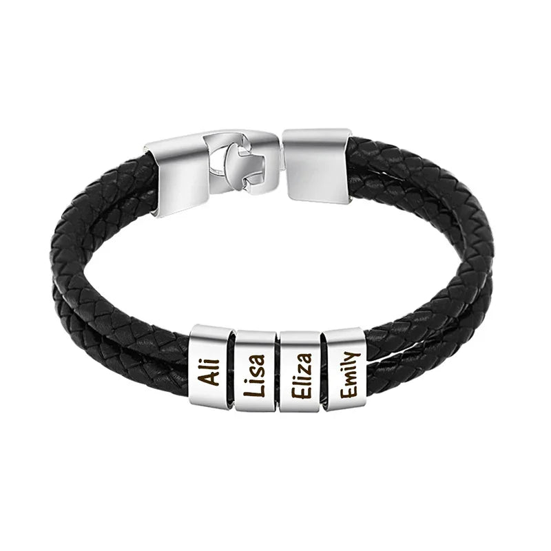 A men's black braided leather bracelet with four stainless steel name beads engraved with the names “Ali,” “Lisa,” “Eliza,” and “Emily.” The bracelet features a polished, secure clasp and a modern, minimal design.