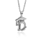 Silver necklace with a 2025 graduation cap and personalized initial pendant engraved with the name Denny.