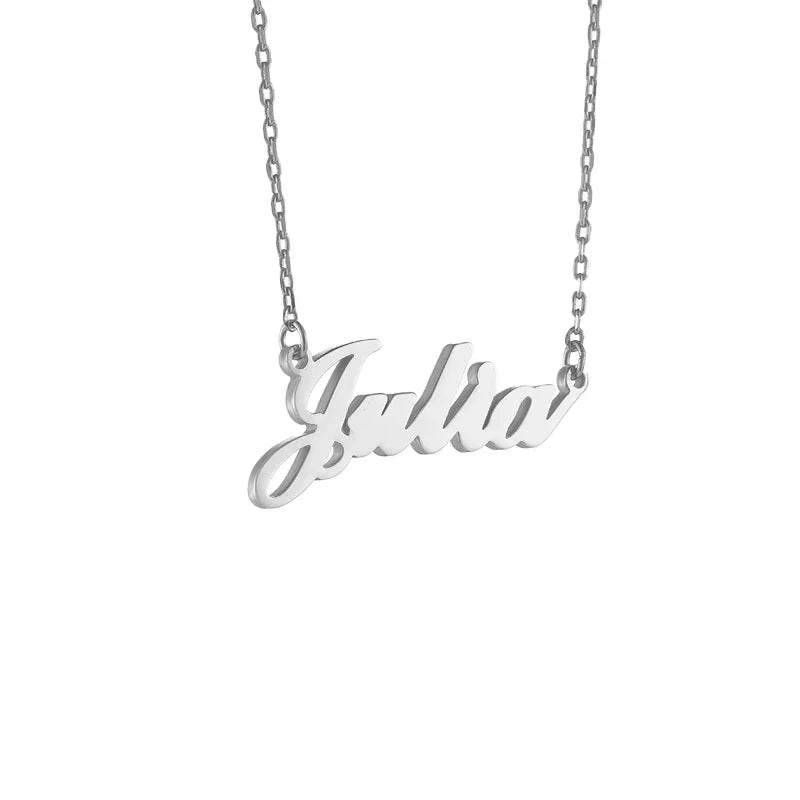 A silver name necklace featuring the name “Julia” in a flowing cursive script. The name pendant is attached to a delicate silver chain, creating a simple and elegant personalized jewelry piece.
