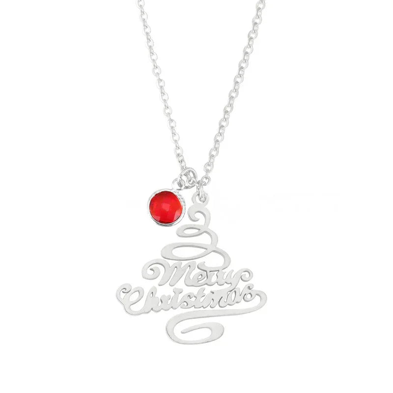 Silver Christmas tree-shaped pendant necklace with “Merry Christmas” text and a small round red gemstone charm, displayed on a white background.