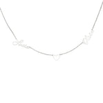 A silver personalized necklace featuring two names, “Lucia” and “Olivia,” connected by a small open heart charm in the center, all crafted in elegant cursive script on a delicate chain.