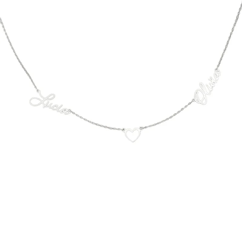 A silver personalized necklace featuring two names, “Lucia” and “Olivia,” connected by a small open heart charm in the center, all crafted in elegant cursive script on a delicate chain.